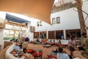 Camel Dive Center- Courtyard with divers enjoying a drink and logging dives