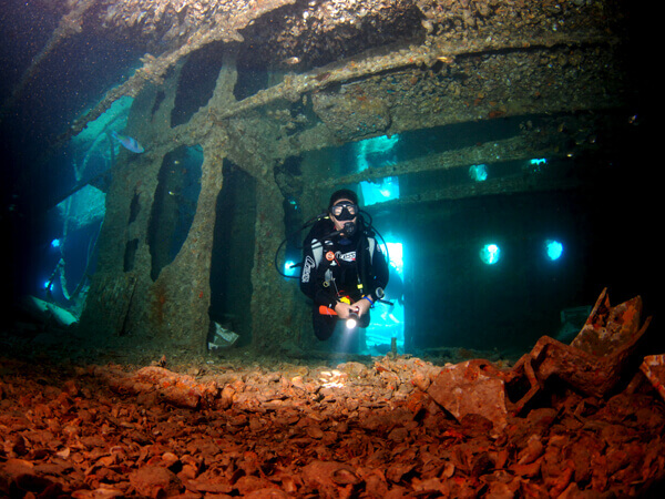 Scuba diving inside the SS Thistlegorm - Captain's cabin